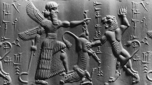 A winged deity in a Mesopotamian relief.