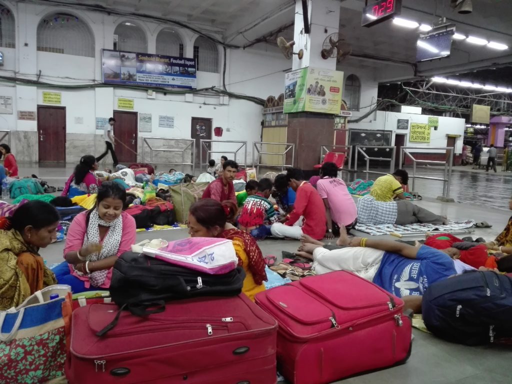 People sleeping on the floor in Kolkata train station